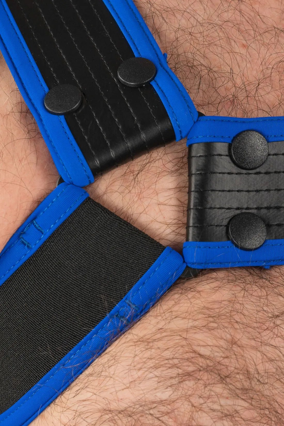 Outtox by Maskulo body harness with snaps in black and blue, a bold accessory from the Maskulo Global online store.
