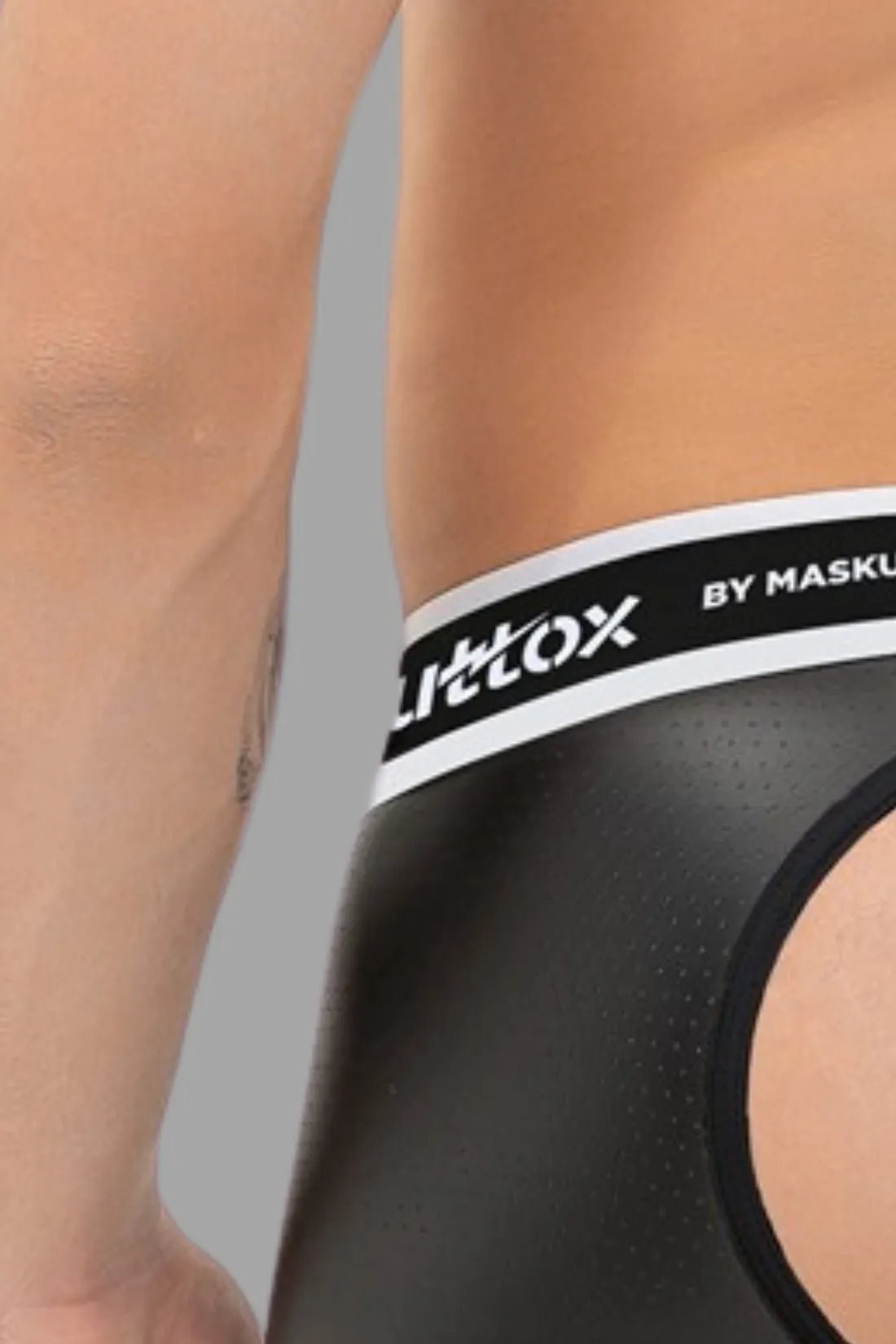 Outtox by Maskulo Open Rear Trunk Shorts with Snap Codpiece in Black, featuring perforated PU eco leather material and waistband logo.