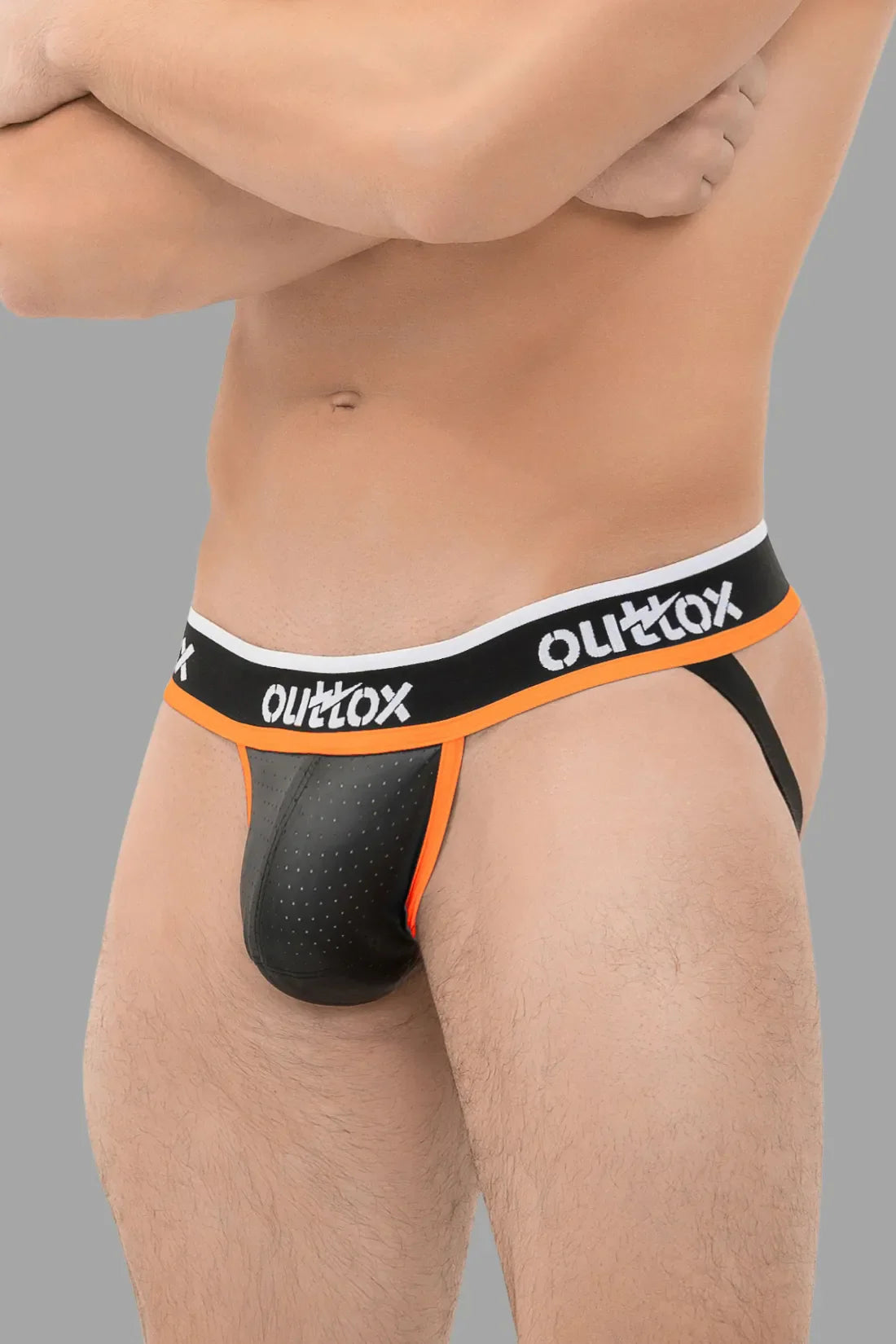 Outtox. Jockstrap avec braguette à boutons-pression. Noir et orange