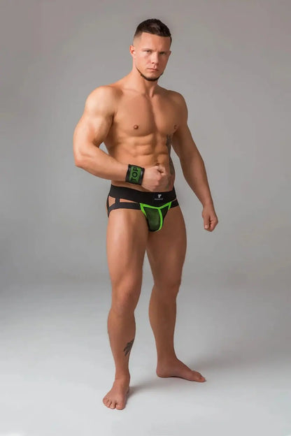 Maskulo Youngero Classic neon green jockstrap for men, featuring a black mesh codpiece and UV glowing accents, appealing to bodybuilders and upper-class millenials.
