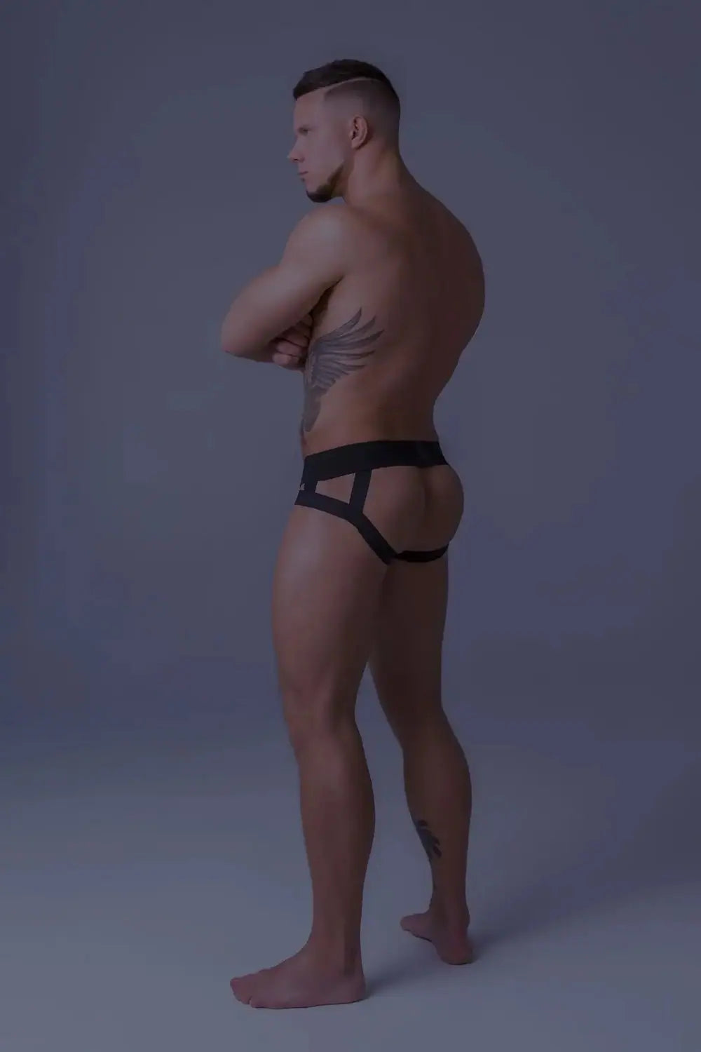 Maskulo Youngero white-neon mesh jockstrap with UV glow codpiece for young urban and gender-fluid men