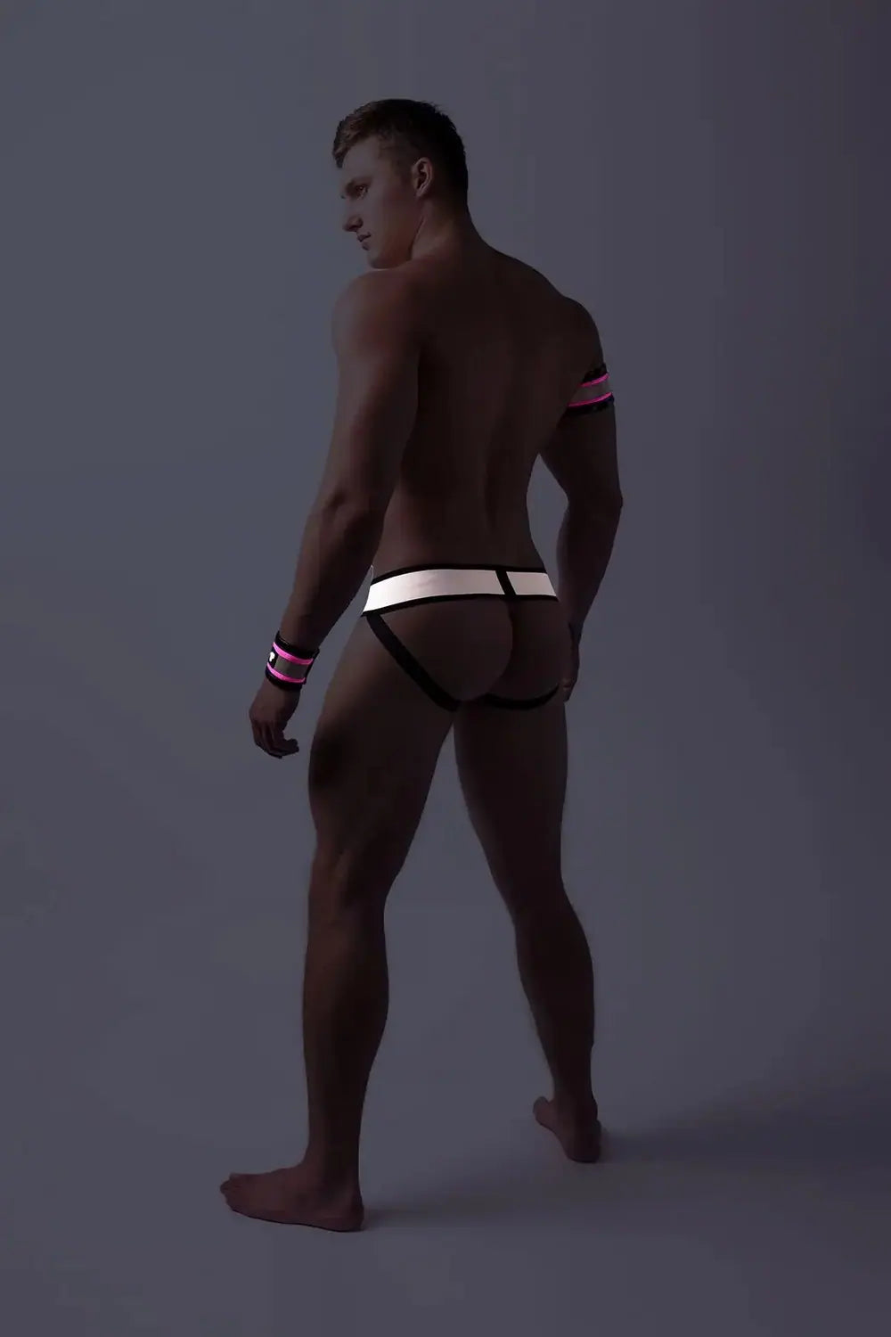 Maskulo Youngero neon pink fetish jockstrap for men with detachable codpiece, UV glowing spandex for fitness and party-goers